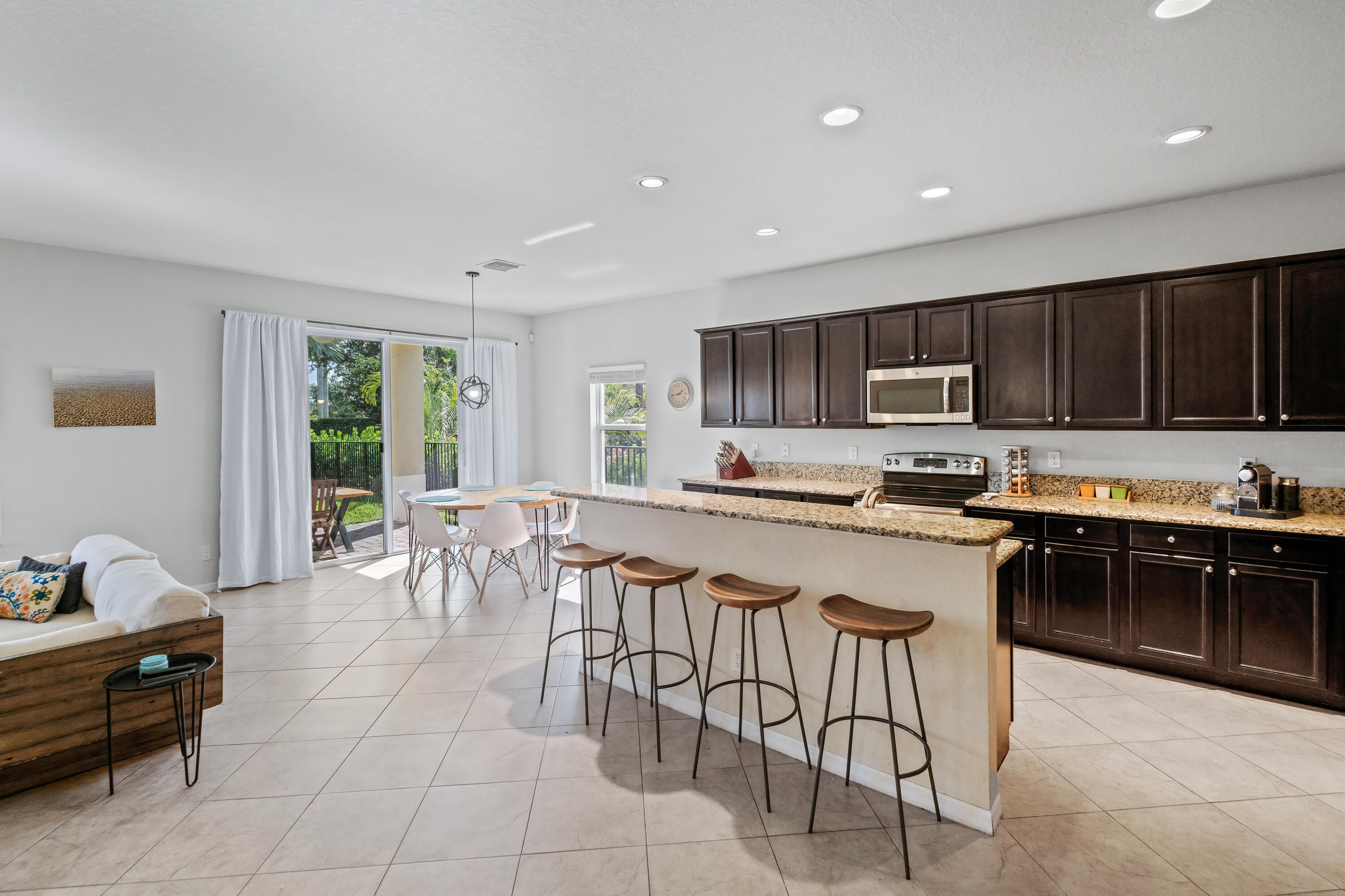 135 Rudder Cay Way Jupiter, FL 33458 - Photo 7 of 25 Kitchen to Family Room