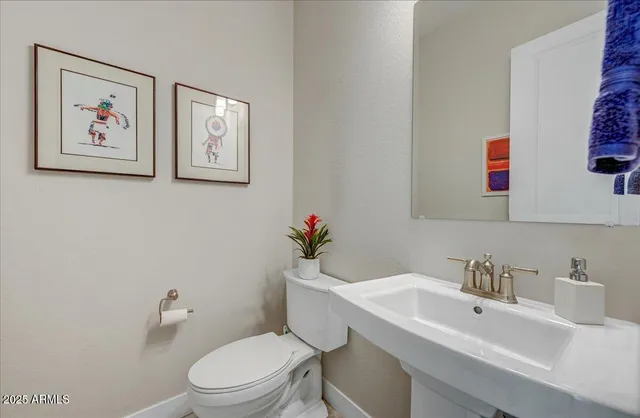 a utility room with a sink washer and dryer