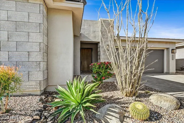 a view of a patio with couches chairs and potted plants