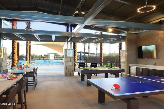 a outdoor space with lots of furniture and swimming pool