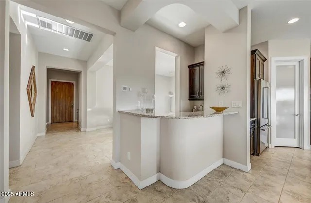 a kitchen with a sink and a refrigerator