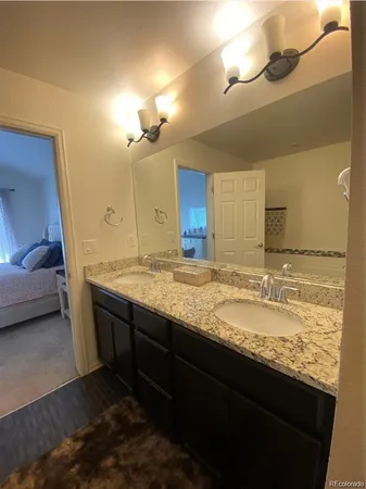 a bathroom with a sink and a shower