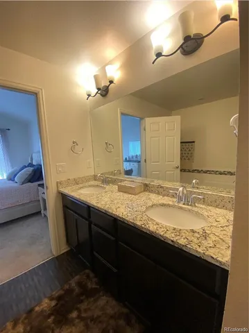 a bathroom with a sink and a shower