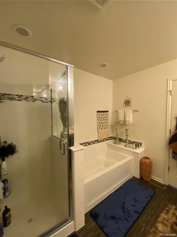 a view of a bathroom with a toilet and a shower
