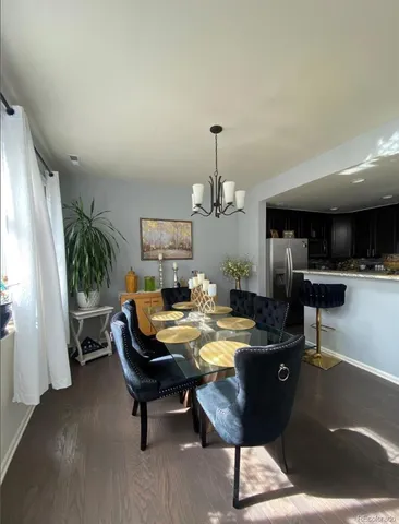 a living room with furniture and a kitchen