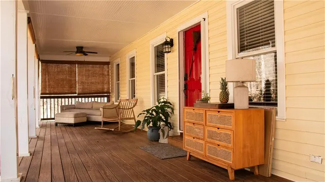 a view of living room with furniture and large window