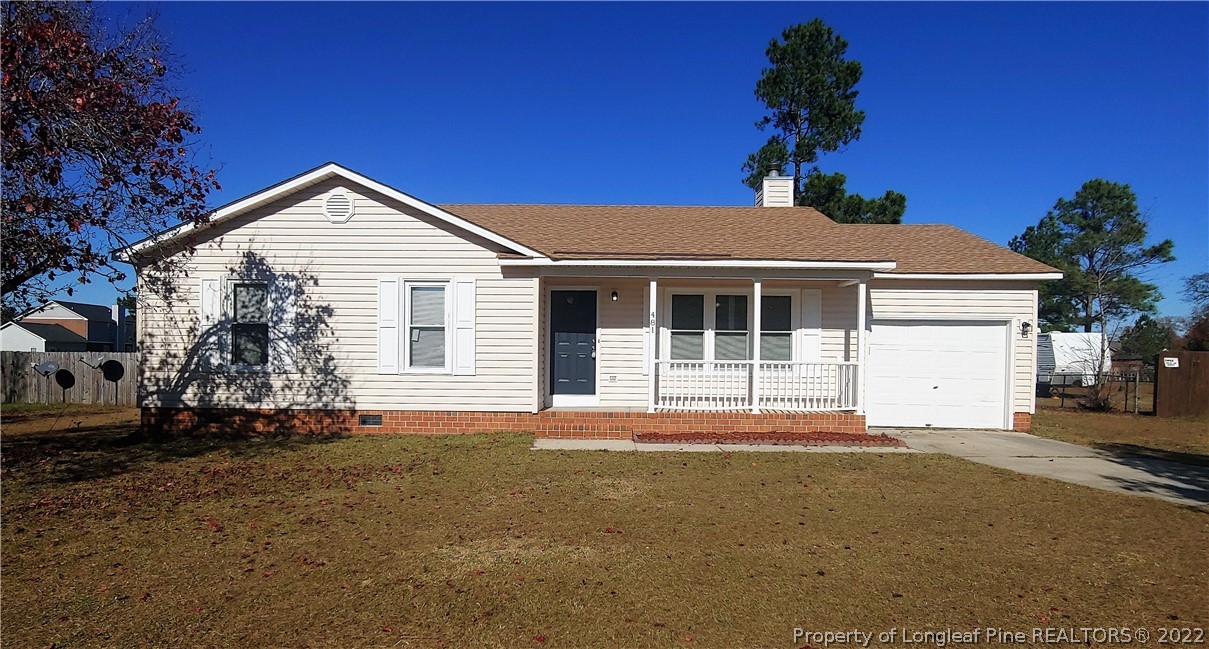 481 Camden Road Raeford, NC 28376 - Photo 1 of 18 a front view of a house with a garden
