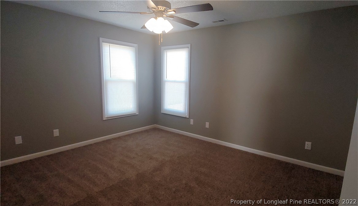 481 Camden Road Raeford, NC 28376 - Photo 14 of 18 an empty room that has a window