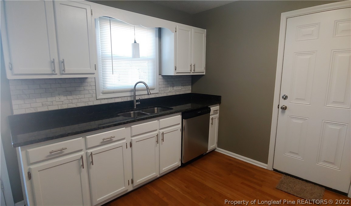 481 Camden Road Raeford, NC 28376 - Photo 8 of 18 a kitchen with sink cabinets and window