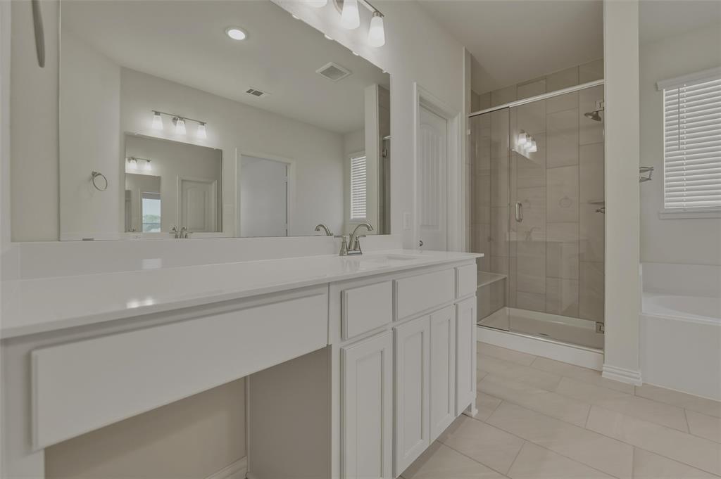 1113 Trinity Drive Springtown, TX 76082 - Photo 28 of 40 Dual vanity with white cabinetry and integrated sinks