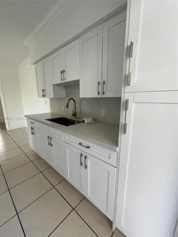 a kitchen with stainless steel appliances granite countertop a sink and a stove