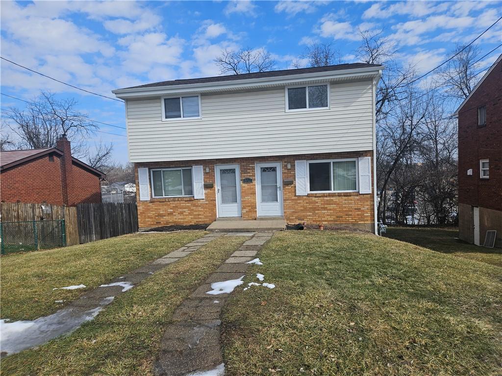 812 Westbury Road, Unit A North Versailles, PA 15137 - Photo 1 of 40 a front view of a house with a yard
