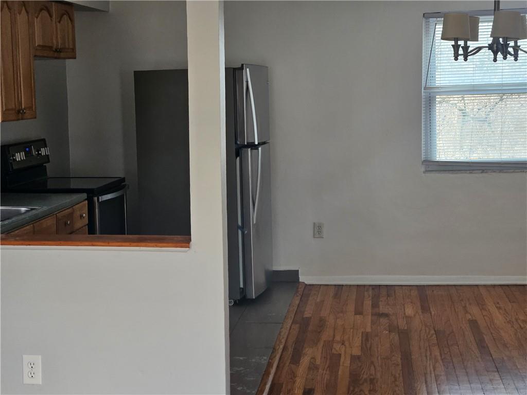 812 Westbury Road, Unit A North Versailles, PA 15137 - Photo 11 of 40 wooden floor in an empty room