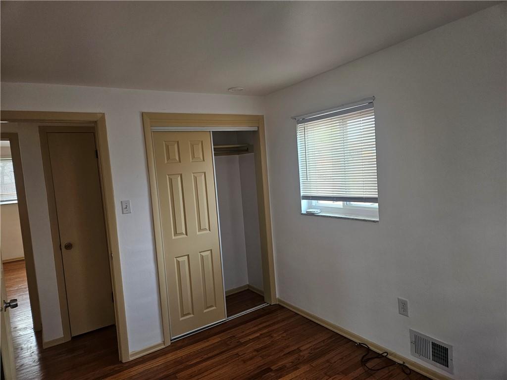 812 Westbury Road, Unit A North Versailles, PA 15137 - Photo 23 of 40 an empty room with wooden floor front door and windows