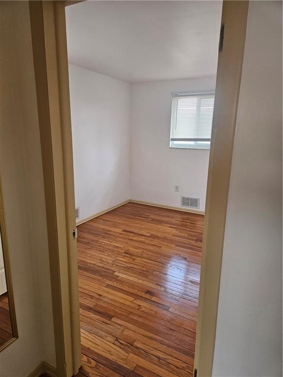 812 Westbury Road, Unit A North Versailles, PA 15137 - Photo 26 of 40 a view of empty room with wooden floor