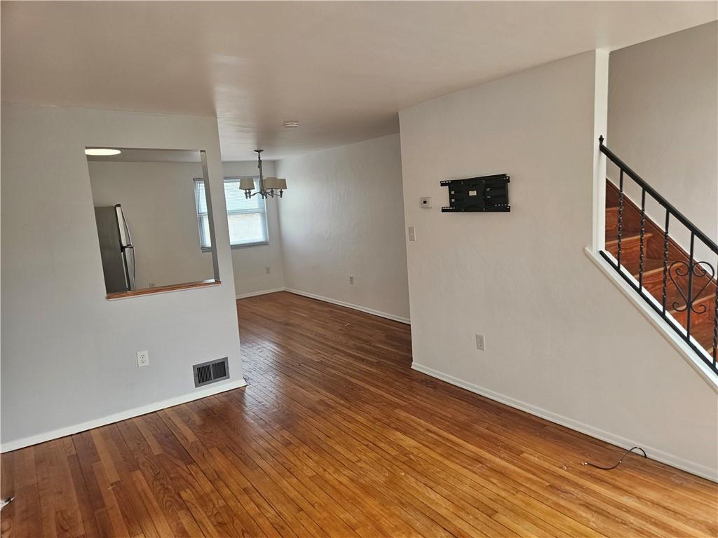 812 Westbury Road, Unit A North Versailles, PA 15137 - Photo 9 of 40 wooden floor in an empty room with a window