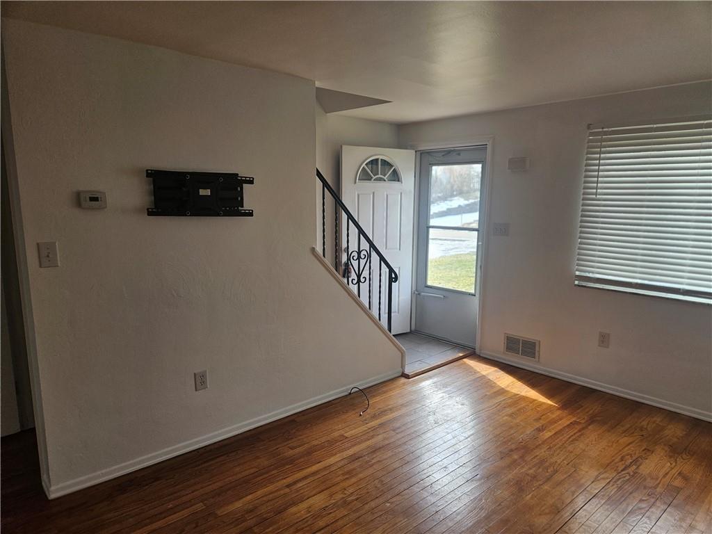 812 Westbury Road, Unit A North Versailles, PA 15137 - Photo 10 of 40 a view of a livingroom with wooden floor and stairs