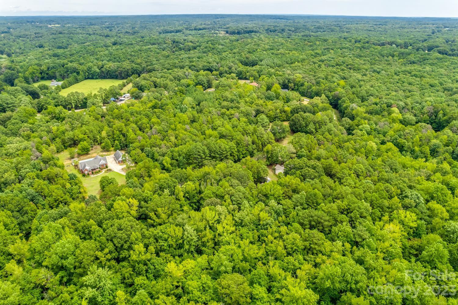 Tbd Wilderness Lane, Unit 18 Lancaster, SC 29720 - Photo 11 of 14 a view of a lush green field with a houses