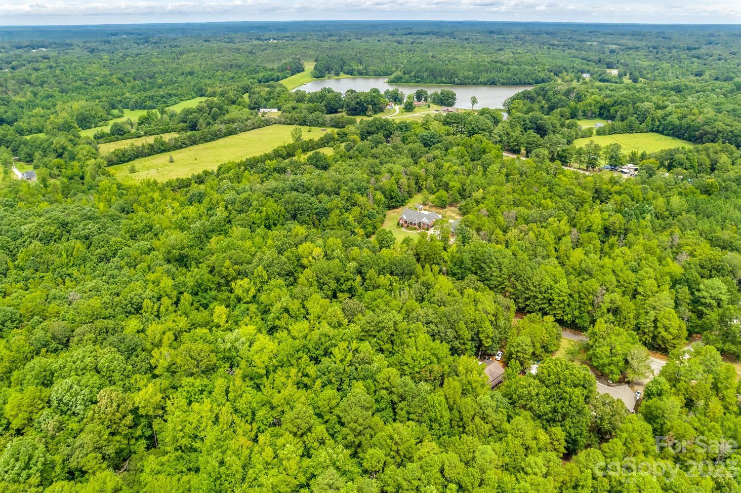 Tbd Wilderness Lane, Unit 18 Lancaster, SC 29720 - Photo 9 of 14 a view of a field of a building with a yard