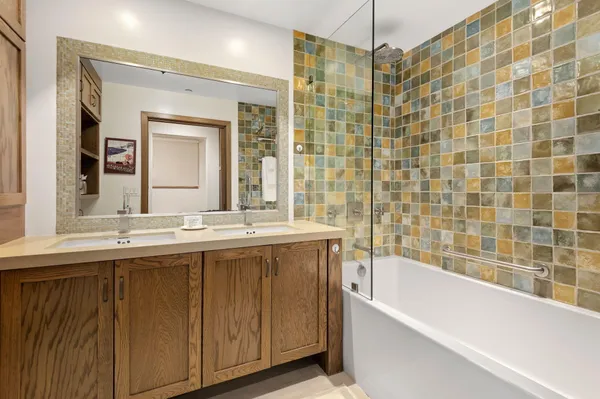 a bathroom with a bathtub and a sink