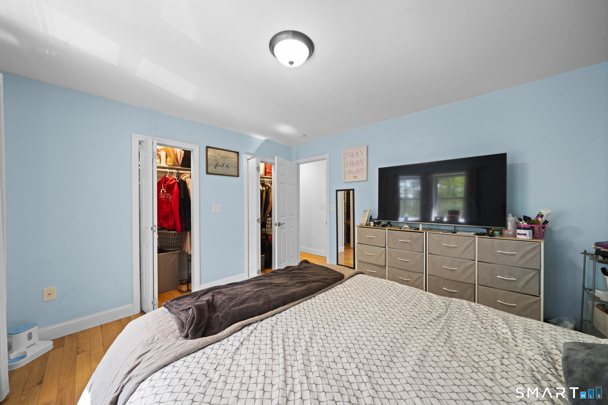 1118 Spindle Hill Road Wolcott, CT 06716 - Photo 25 of 38 a bedroom with a bed and a flat screen tv
