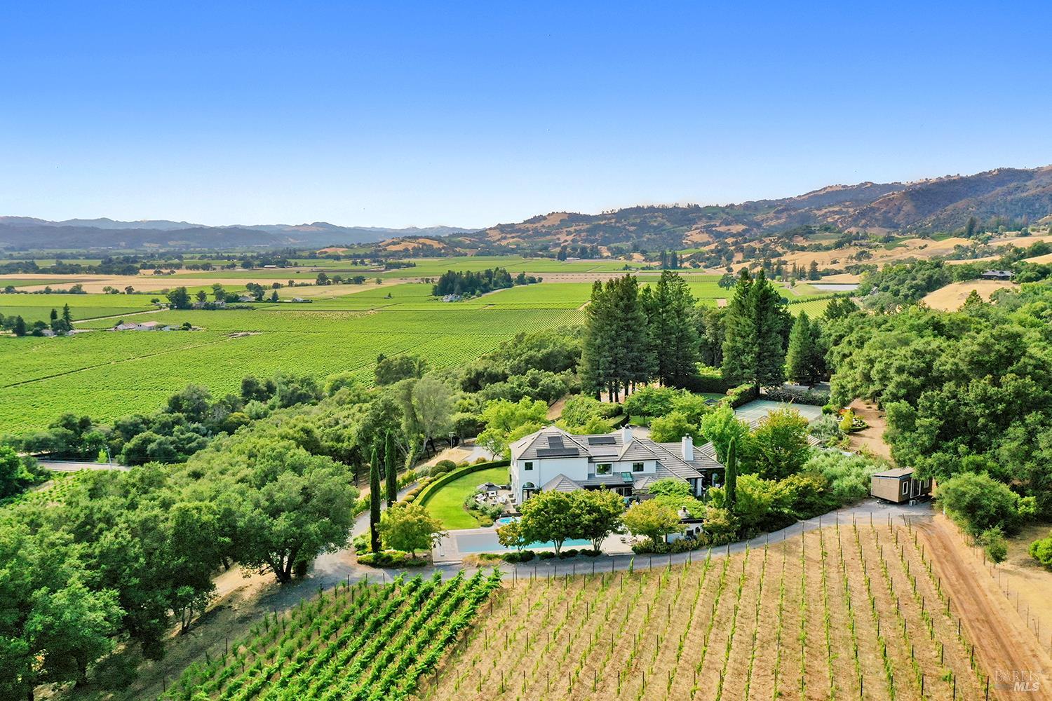 4395 Pine Flat Road Healdsburg, CA 95448 - Photo 4 of 76 Sitting at the base of Pine Flat, perched above Alexander Valley with its gorgeous views, is this one of a kind Healdsburg estate home with pool, gardens, gentleman's vineyard, tennis court and a guest suite with kitchen.