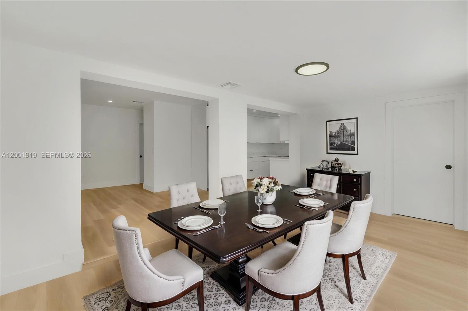 7970 Northwest 176th Street Hialeah, FL 33015 - Photo 14 of 32 a view of a dining room with furniture and wooden floor