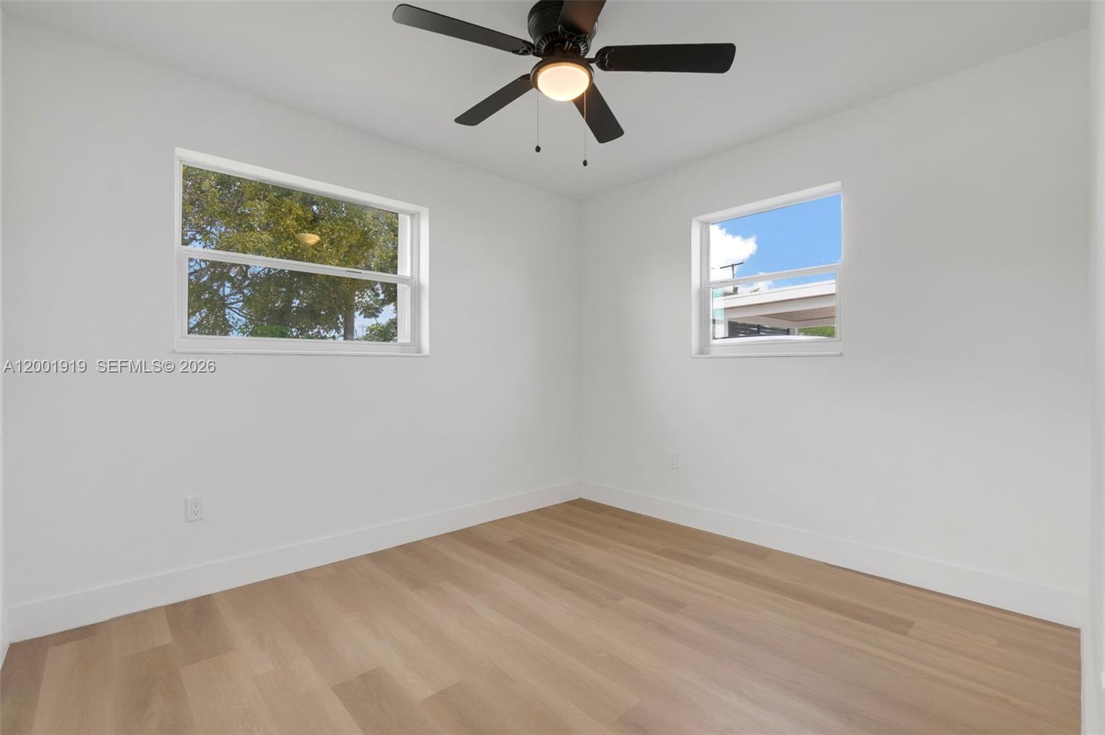7970 Northwest 176th Street Hialeah, FL 33015 - Photo 19 of 32 a view of empty room with wooden floor