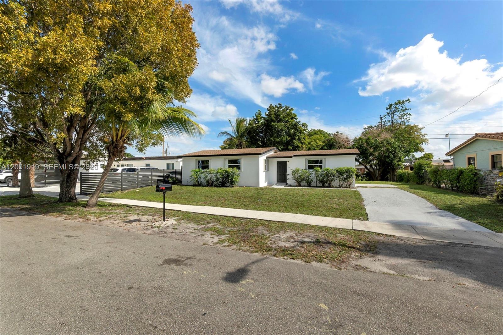 7970 Northwest 176th Street Hialeah, FL 33015 - Photo 2 of 32 a view of a house with a backyard