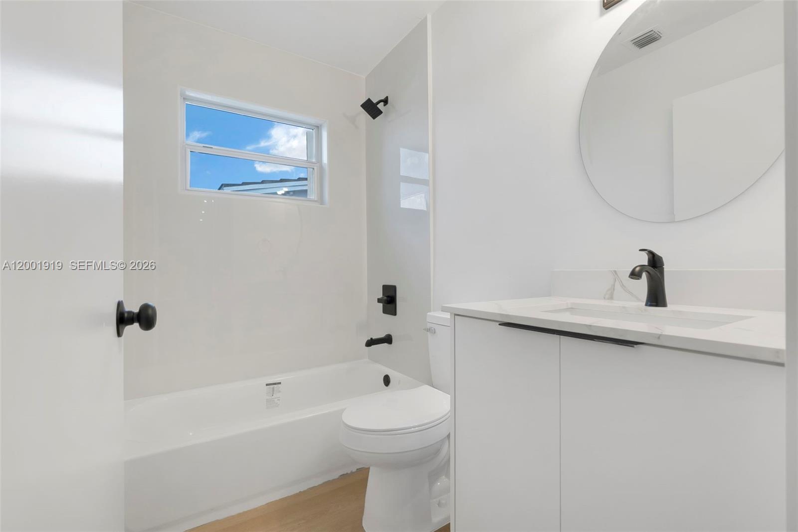 7970 Northwest 176th Street Hialeah, FL 33015 - Photo 22 of 32 a bathroom with a sink a toilet and shower