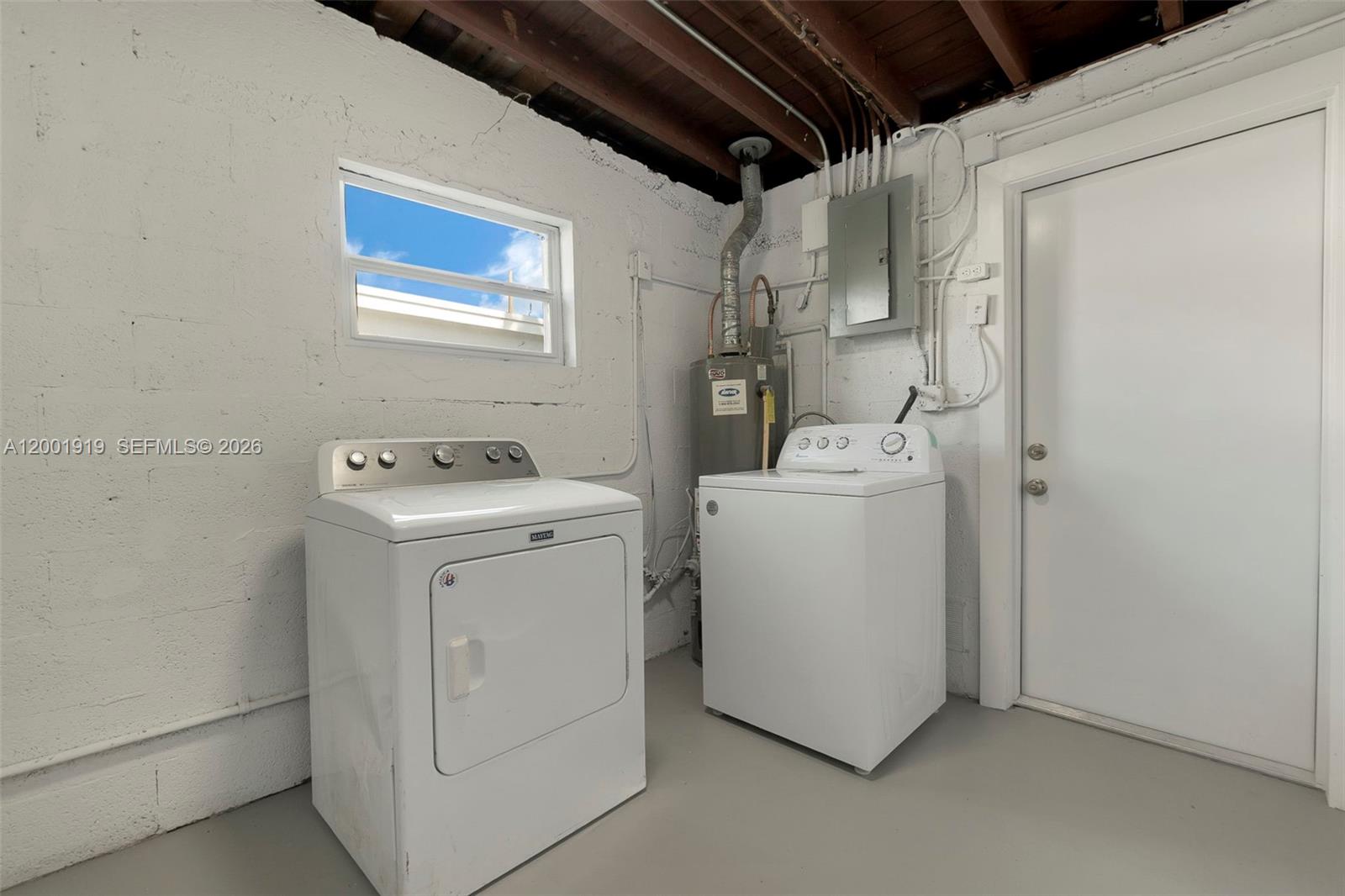 7970 Northwest 176th Street Hialeah, FL 33015 - Photo 25 of 32 a utility room with dryer and washer