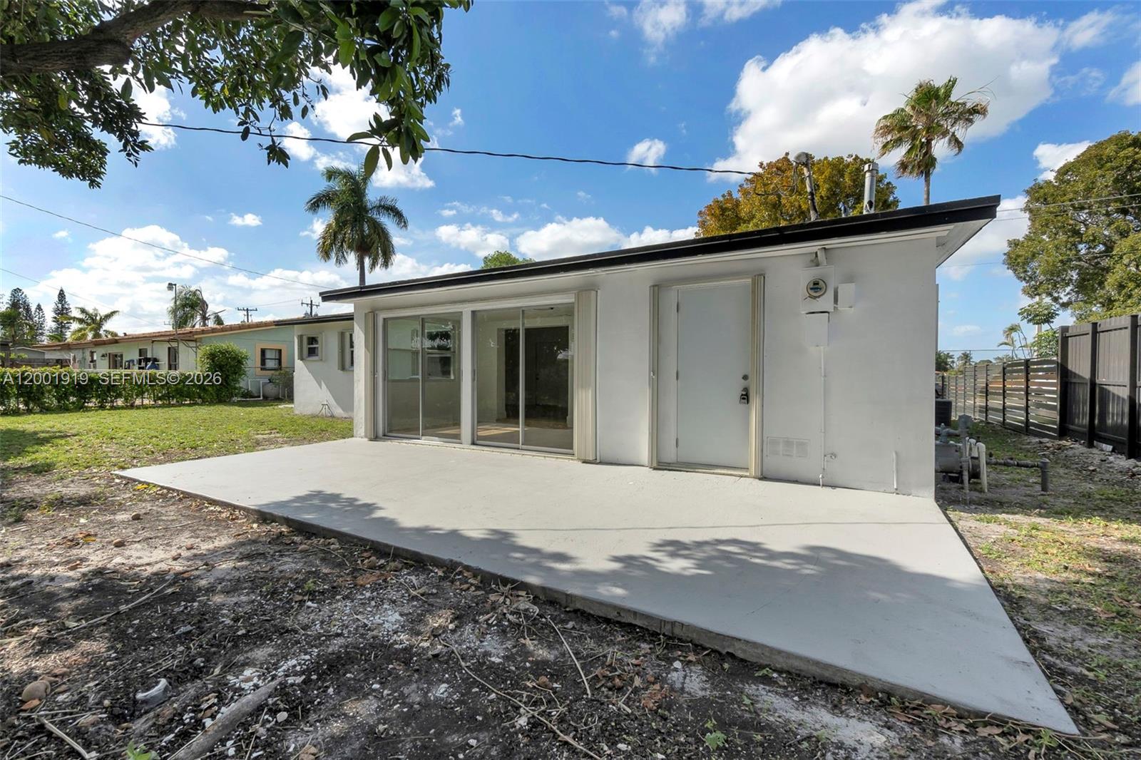 7970 Northwest 176th Street Hialeah, FL 33015 - Photo 26 of 32 a front view of a house with garden