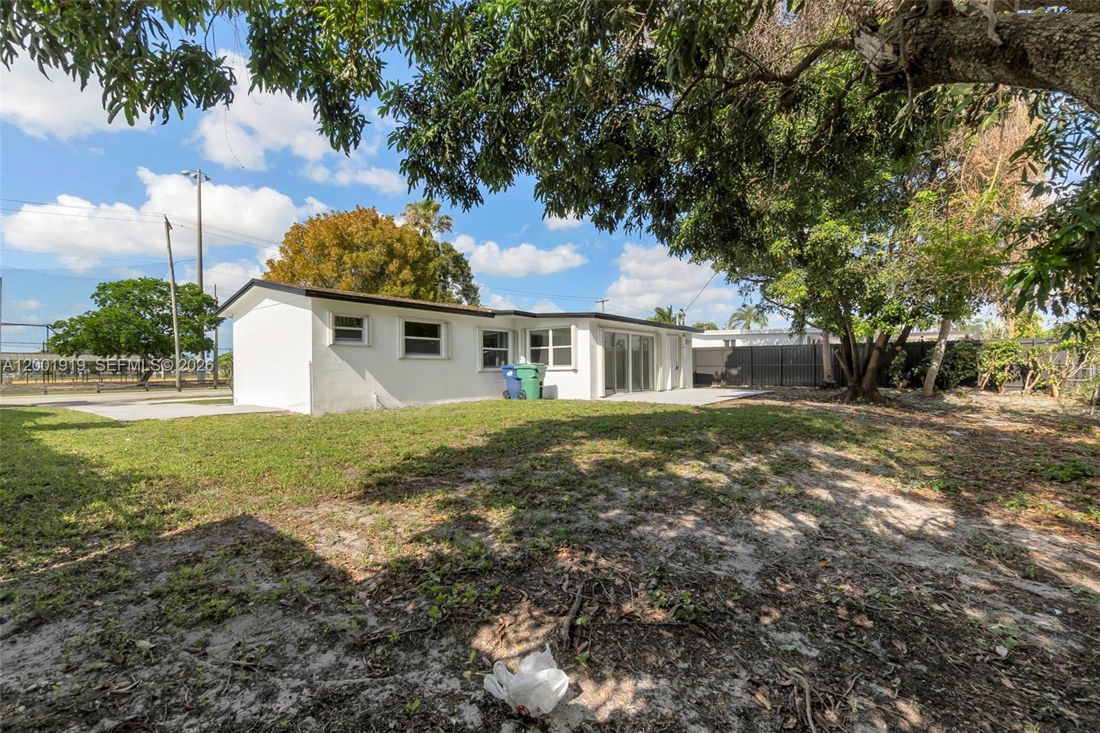 7970 Northwest 176th Street Hialeah, FL 33015 - Photo 27 of 32 a front view of a house with garden