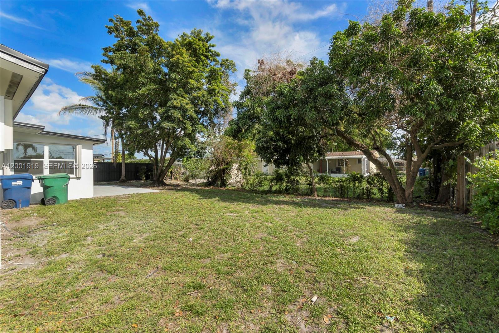 7970 Northwest 176th Street Hialeah, FL 33015 - Photo 28 of 32 a front view of a house with a garden