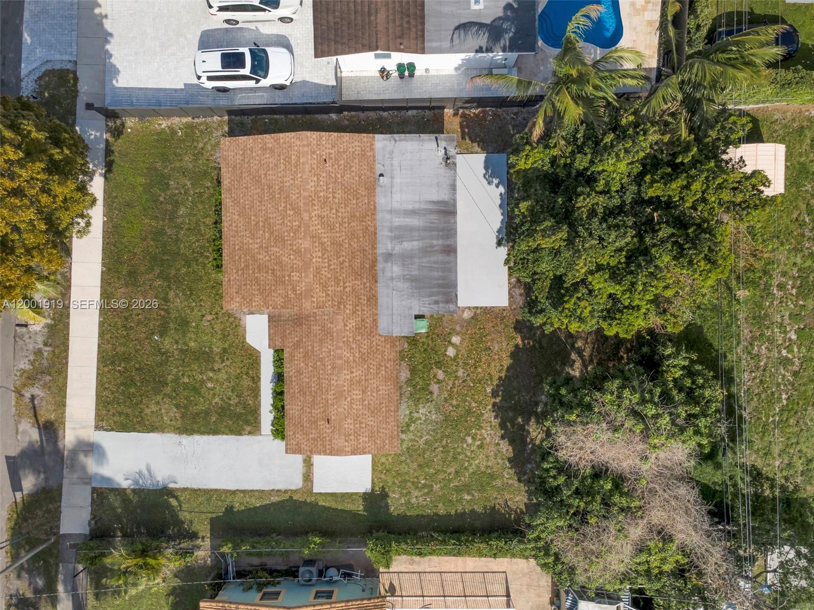 7970 Northwest 176th Street Hialeah, FL 33015 - Photo 29 of 32 a aerial view of a house with a yard