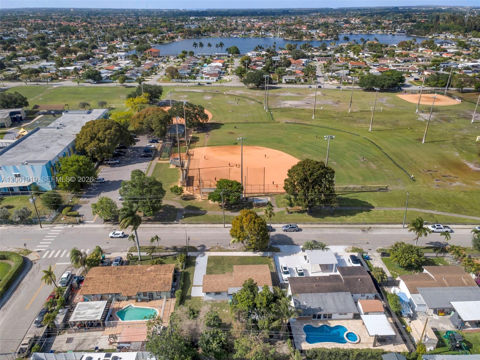 7970 Northwest 176th Street Hialeah, FL 33015 - Photo 30 of 32 an aerial view of residential houses with outdoor space
