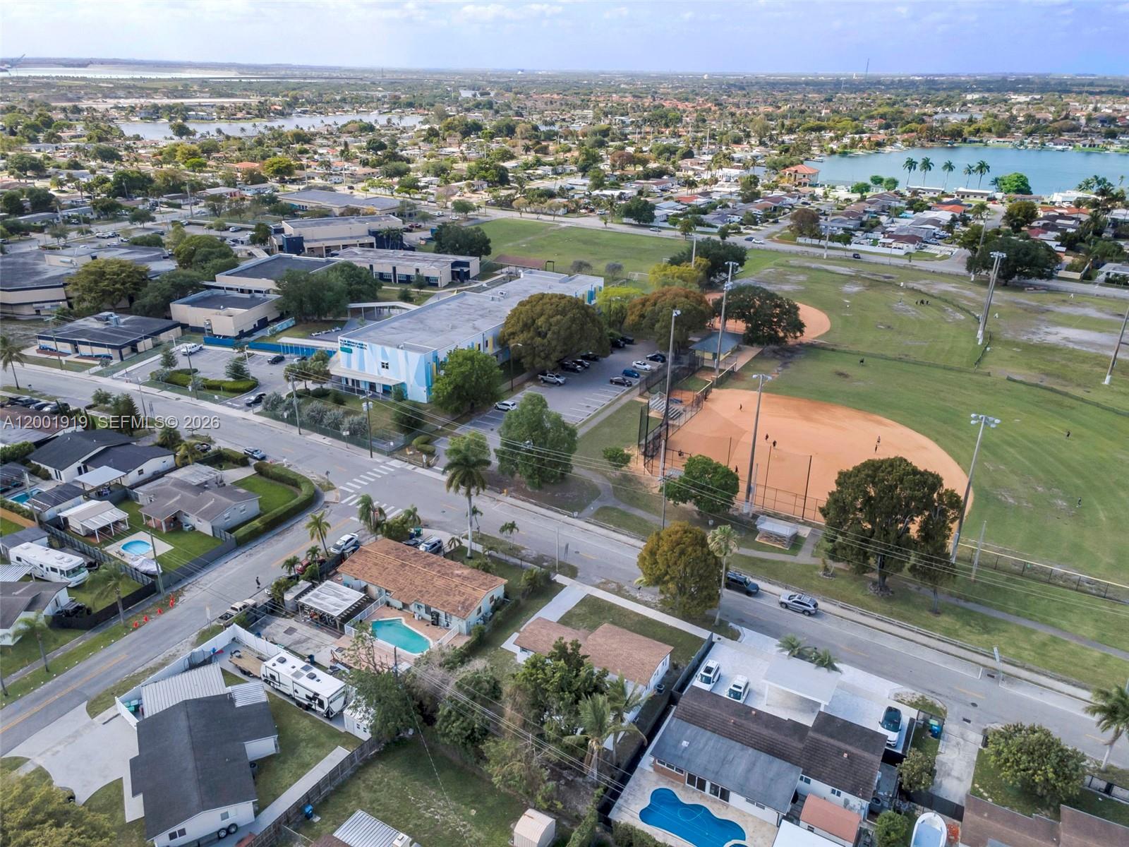 7970 Northwest 176th Street Hialeah, FL 33015 - Photo 32 of 32 an aerial view of a city with a lake view