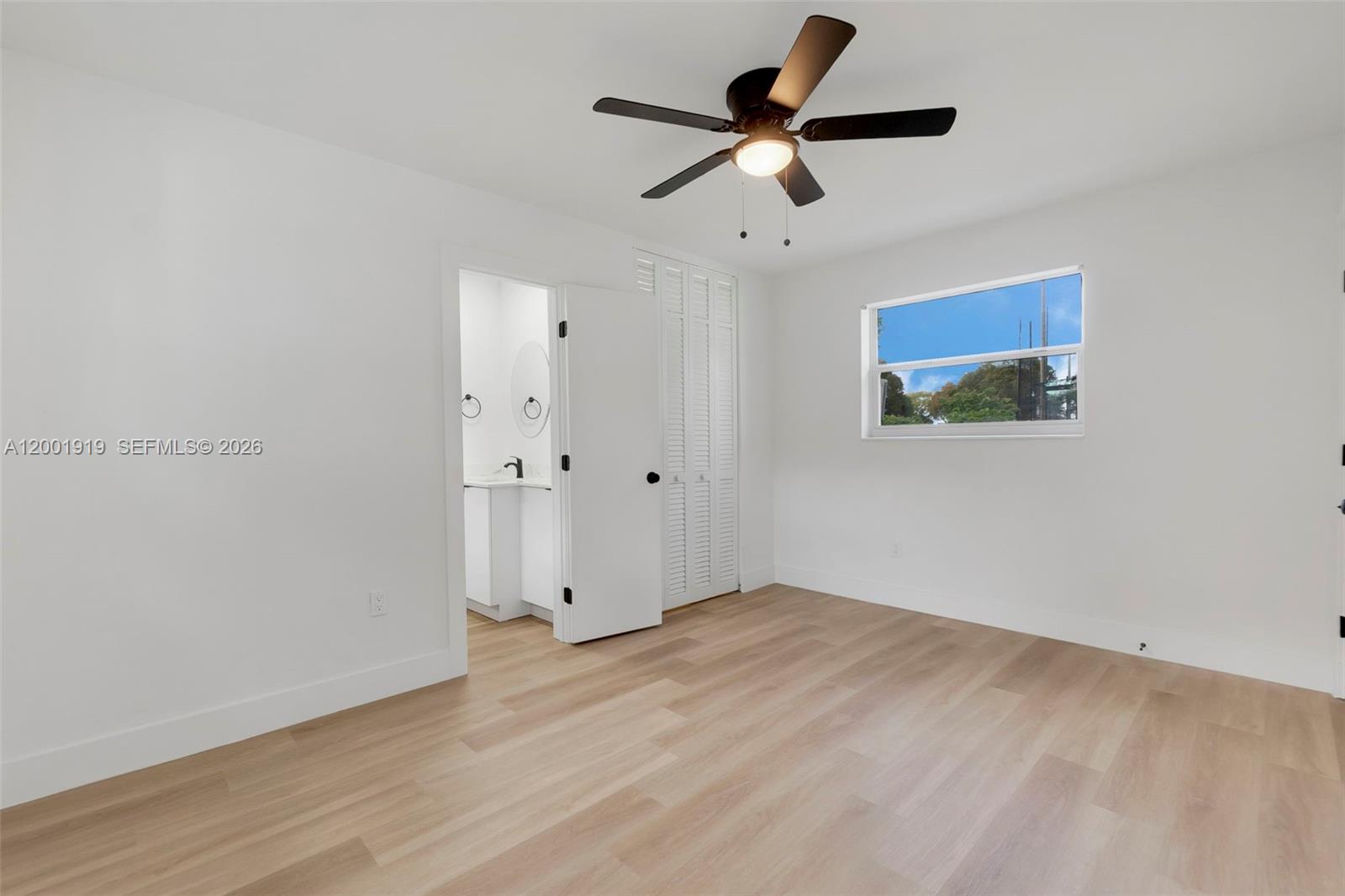 7970 Northwest 176th Street Hialeah, FL 33015 - Photo 7 of 32 wooden floor in an empty room