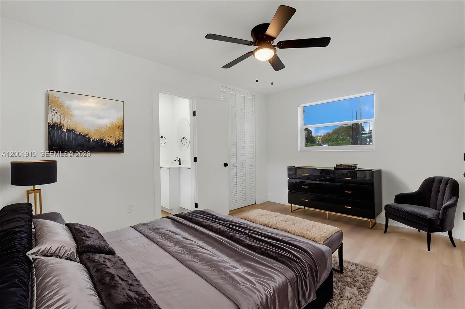 7970 Northwest 176th Street Hialeah, FL 33015 - Photo 9 of 32 a bedroom with a bed and a couch