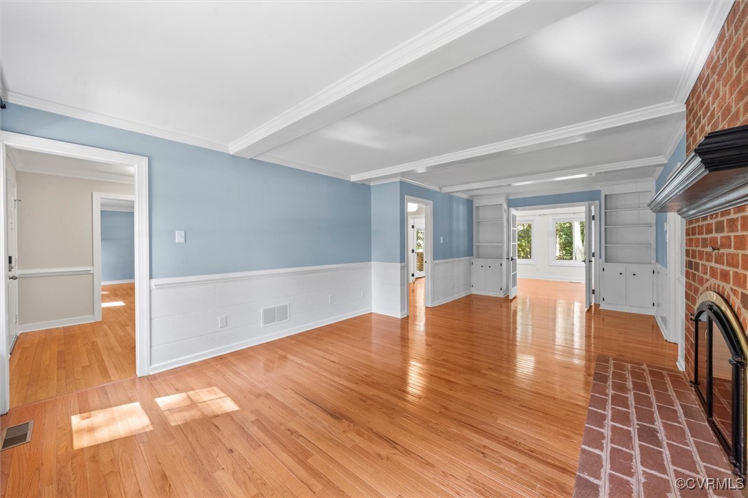 2430 Olde Stone Road Midlothian, VA 23113 - Photo 15 of 46 a view of an empty room with wooden floor and a fireplace