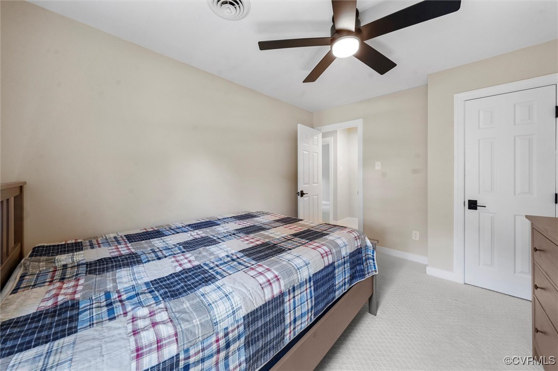 2430 Olde Stone Road Midlothian, VA 23113 - Photo 33 of 46 a bedroom with a bed and a chandelier