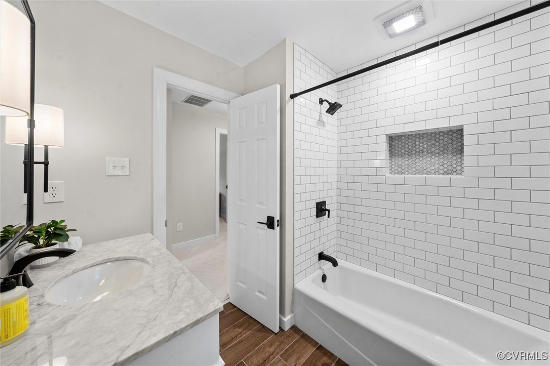 2430 Olde Stone Road Midlothian, VA 23113 - Photo 38 of 46 a bathroom with a tub shower and sink