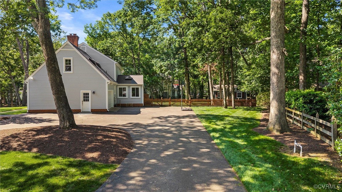 2430 Olde Stone Road Midlothian, VA 23113 - Photo 44 of 46 a backyard of a house with lots of green space