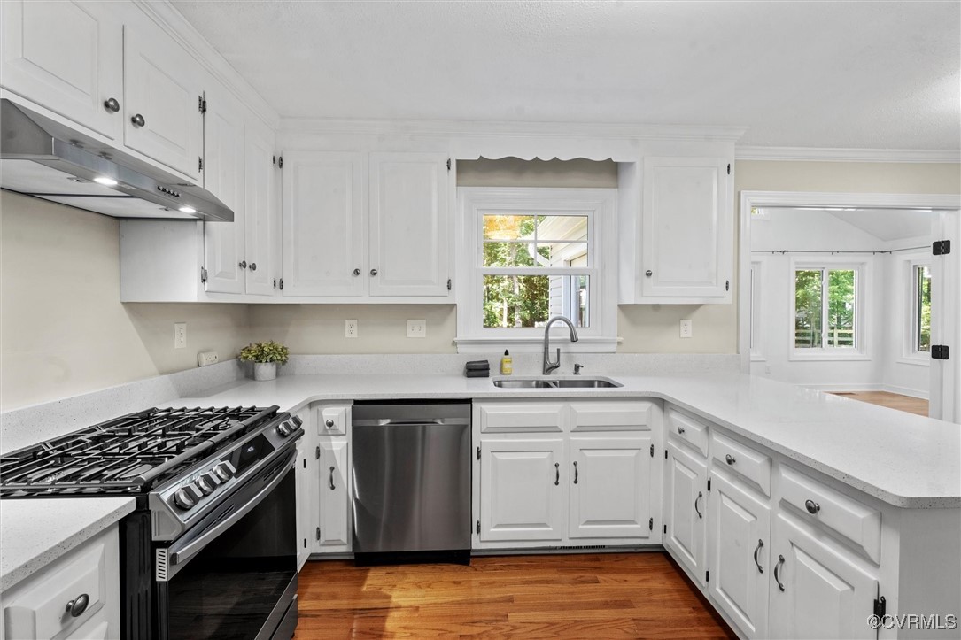 2430 Olde Stone Road Midlothian, VA 23113 - Photo 7 of 46 a kitchen with stainless steel appliances granite countertop a sink stove and cabinets