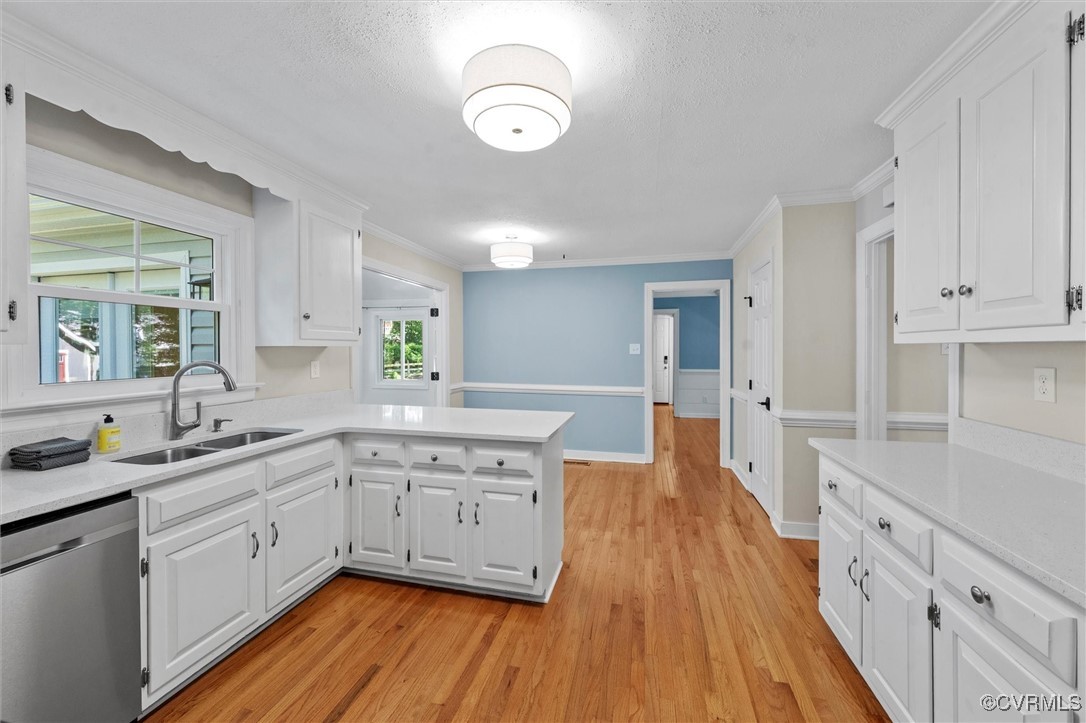 2430 Olde Stone Road Midlothian, VA 23113 - Photo 8 of 46 a kitchen with wooden floors sink and white cabinets