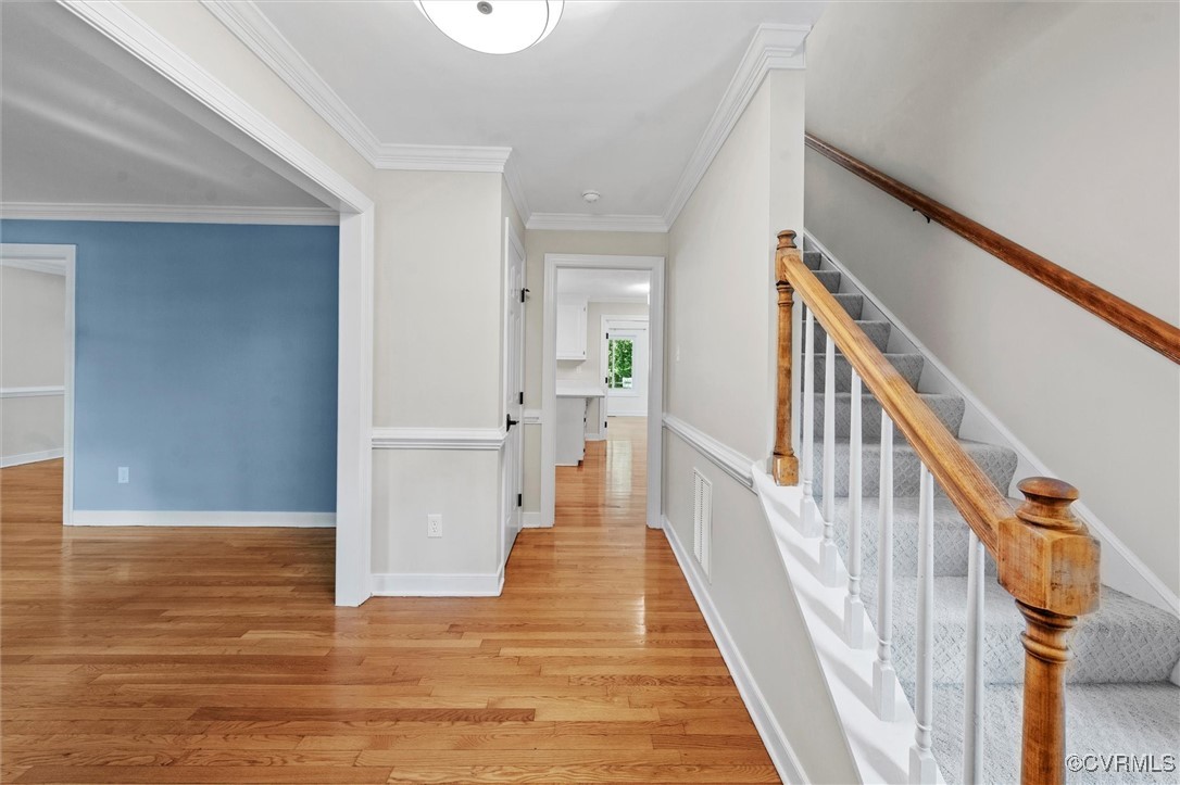 2430 Olde Stone Road Midlothian, VA 23113 - Photo 9 of 46 a view of a hallway with wooden floor and staircase