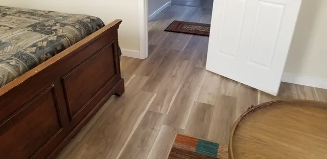 a view of balcony with wooden floor