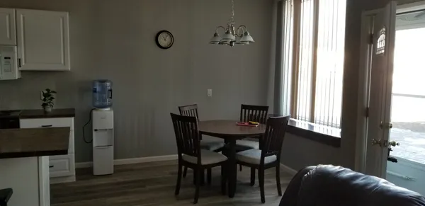 a view of a dining room with furniture and window