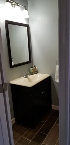 a bathroom with a sink and a mirror