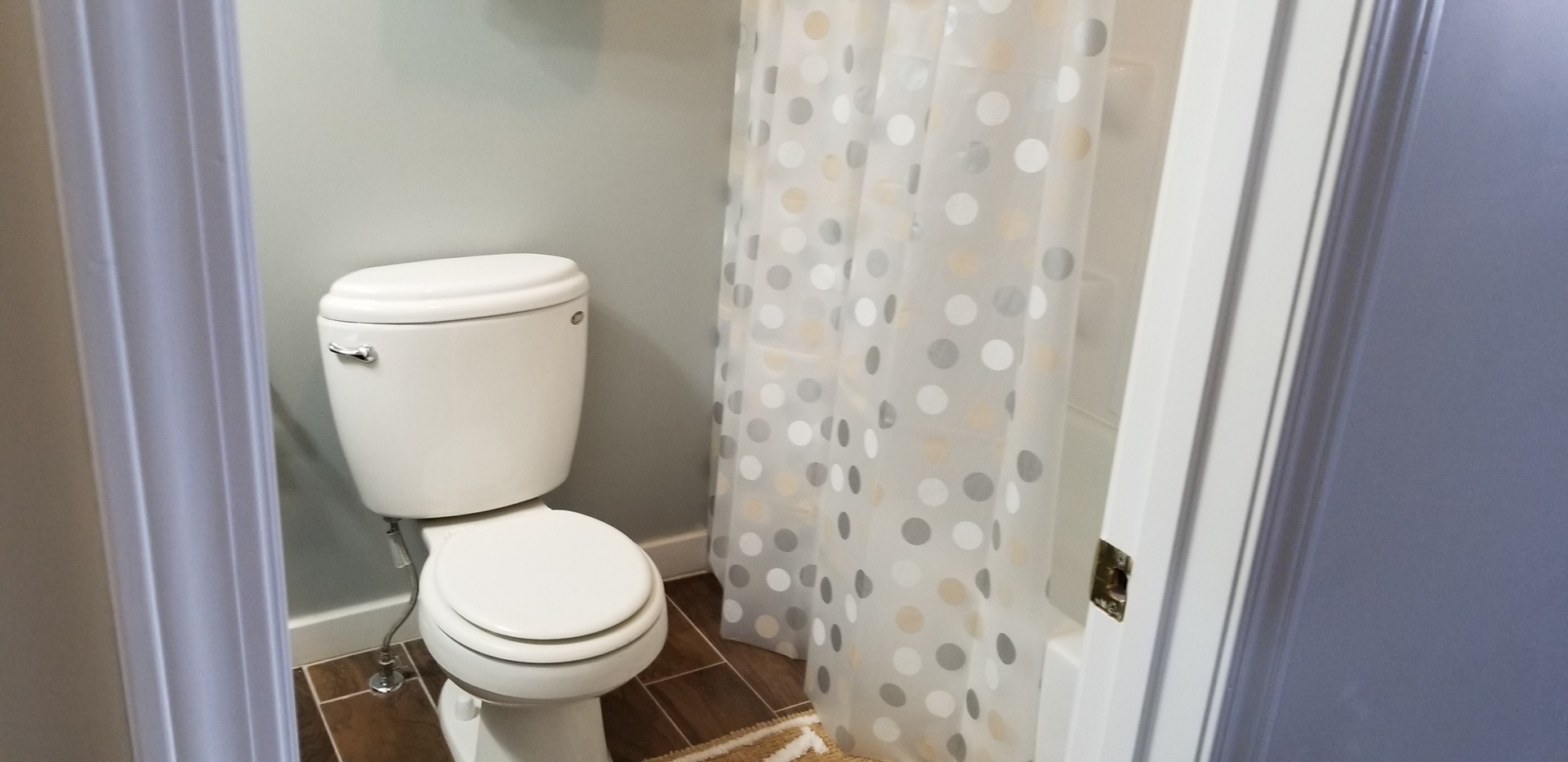 1402 5th Street, Unit 1402 LaSalle, IL 61301 - Photo 9 of 17 a white toilet sitting next to a shower